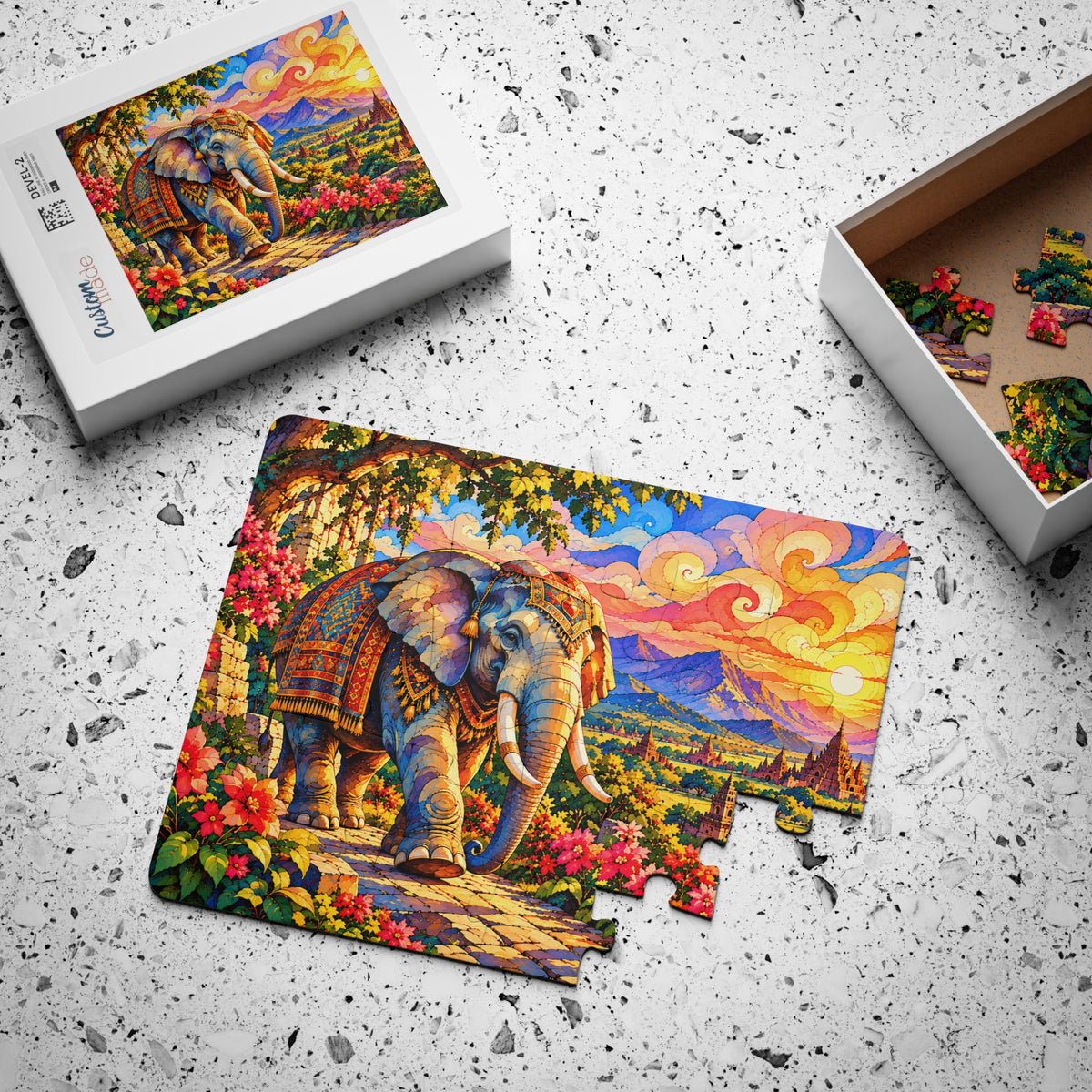 Majestic Elephant Sunset jigsaw puzzle, partly assembled, with its box