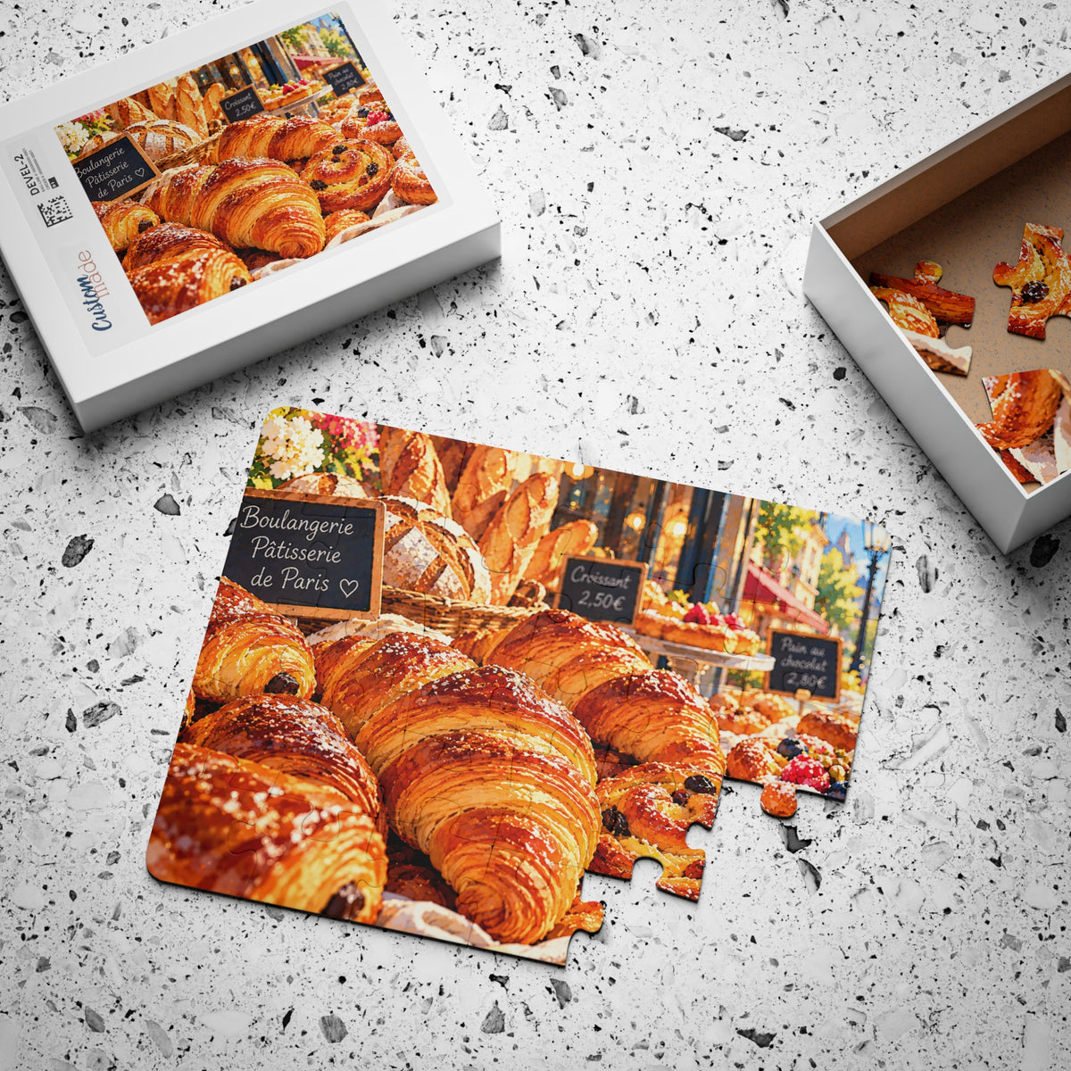 Croissants in Paris jigsaw puzzle, partly assembled, with its box