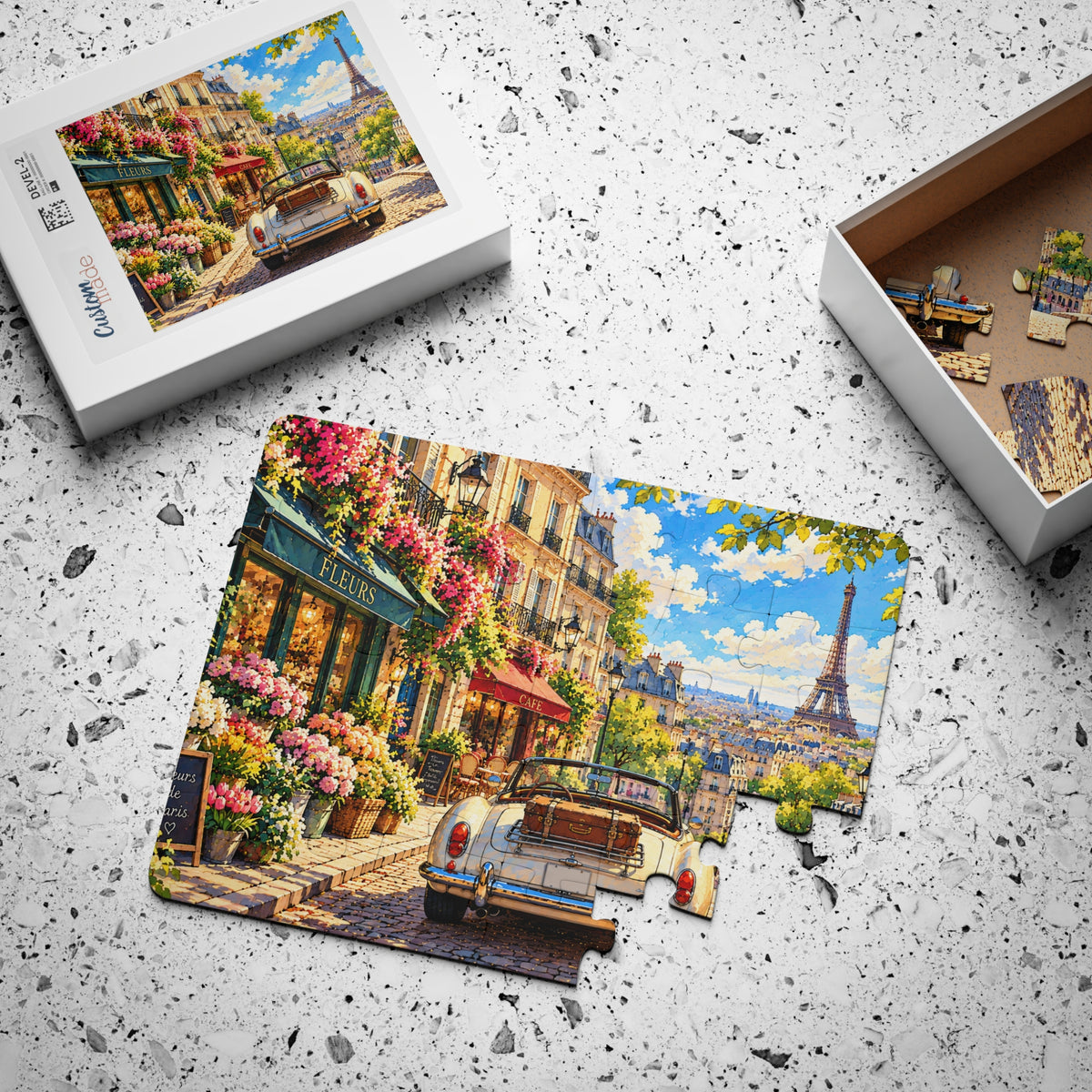 Paris Flower Street jigsaw puzzle, partly assembled, with its box