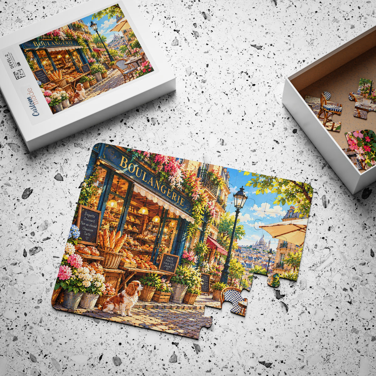 Paris Bakery Morning jigsaw puzzle, partly assembled, with its box