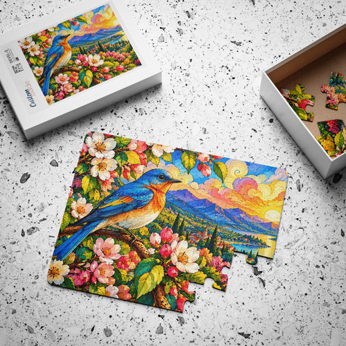 Bluebird Spring Blossoms jigsaw puzzle, partly assembled, with its box